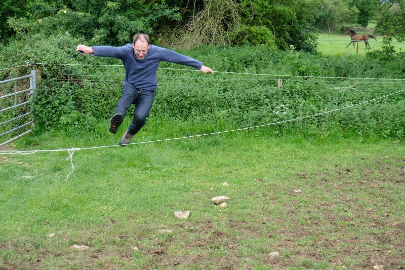 Peter Kerr showing how to avoid an electric fence...