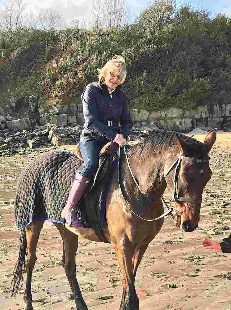 Ali Sulin riding her old horse Charingworth.. He is loving his retirement from racing
