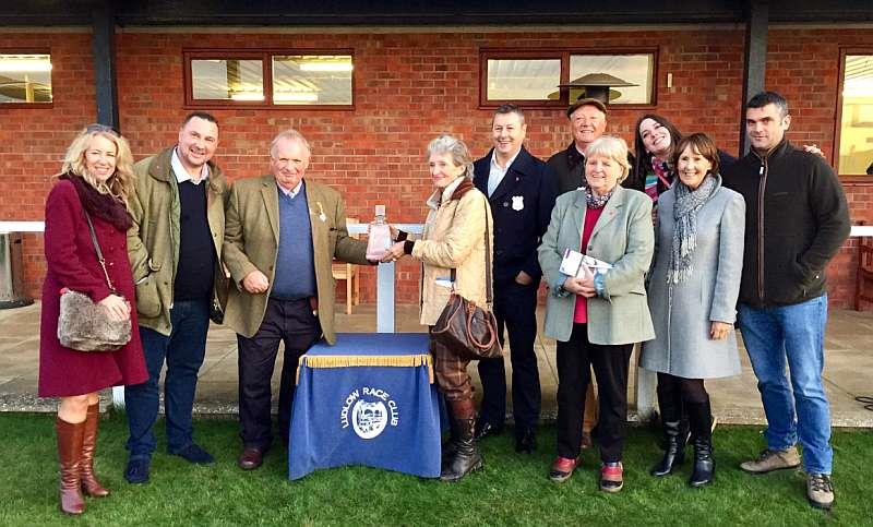 Ludlow racecourse Director David Minton handing out the winners prize