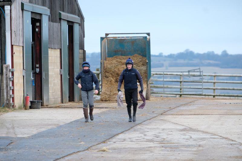 Jess and Mikey walking towards the tack room