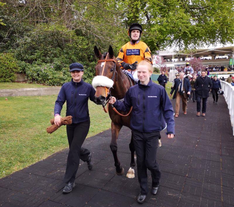 Leigh Pollard and Will Hodkinson leading Younevercall back along the famous Sandown walkway to the winners enclosure.