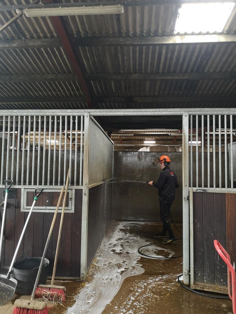 Ben jet washing the stables