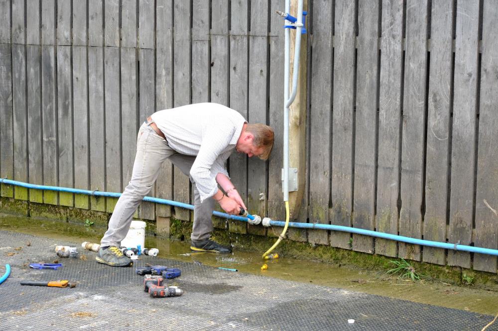 Tony Evans repairing the hoses..