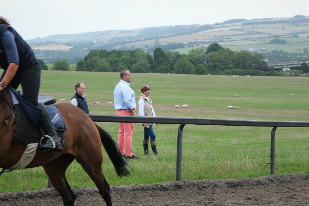 Neil and Olivia watching the horses