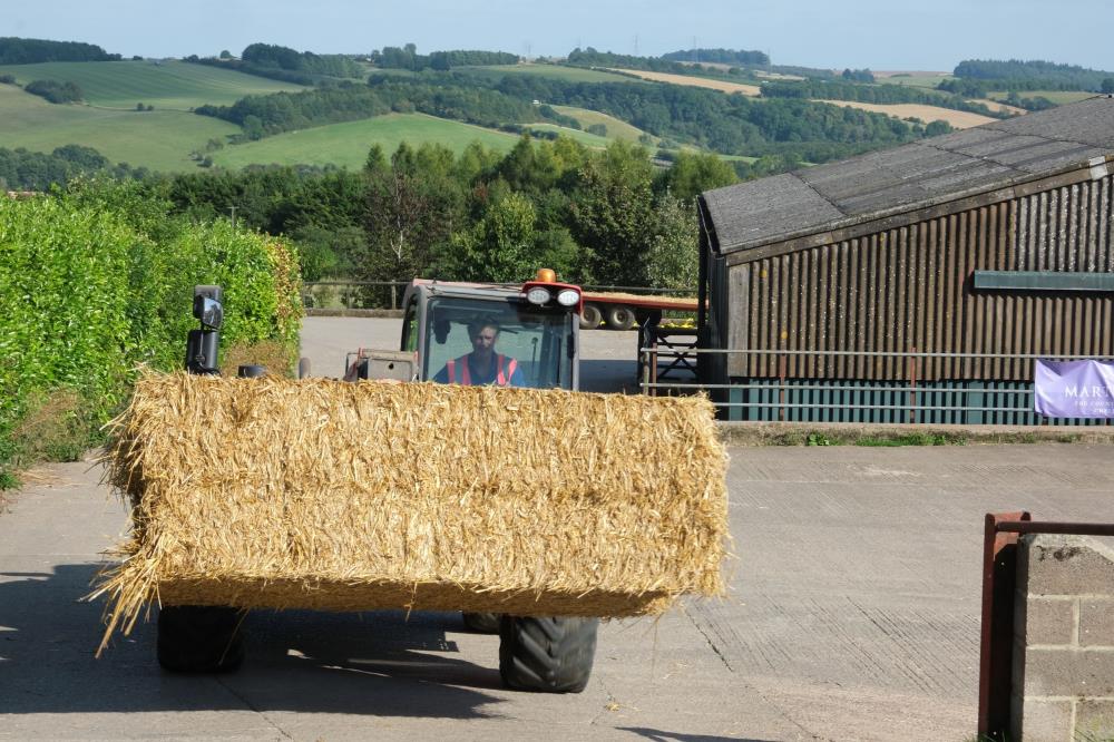 Hamish Campbell delivering straw