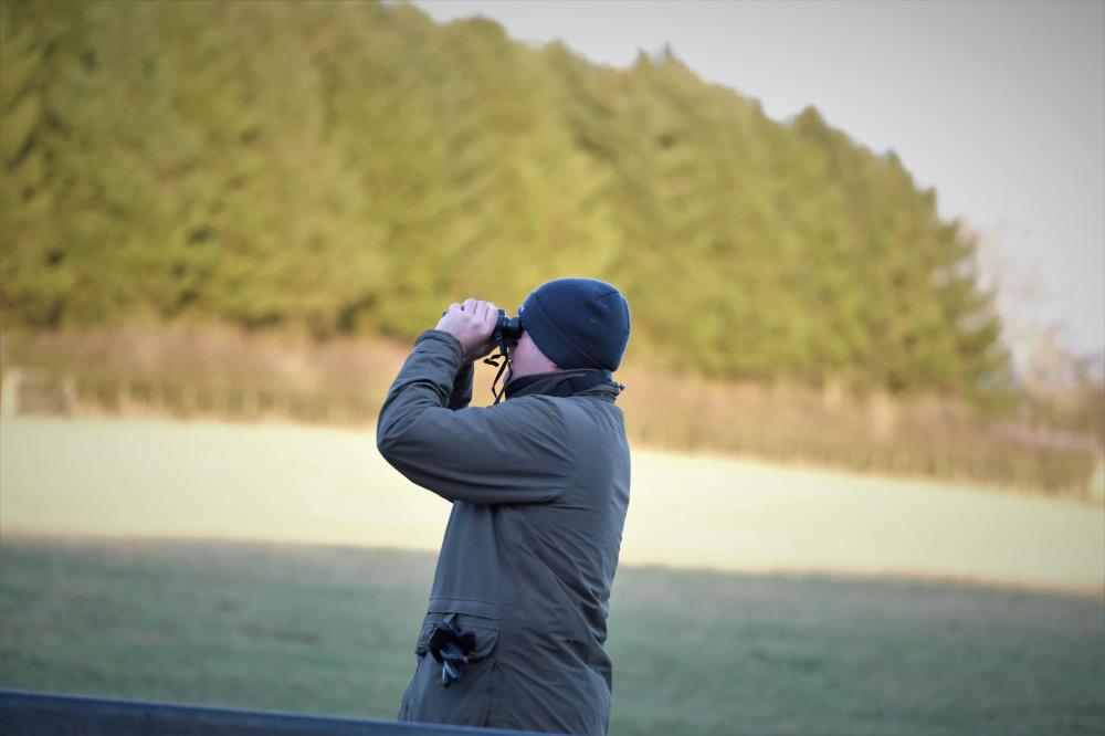 Mat checking how his new binoculars work.