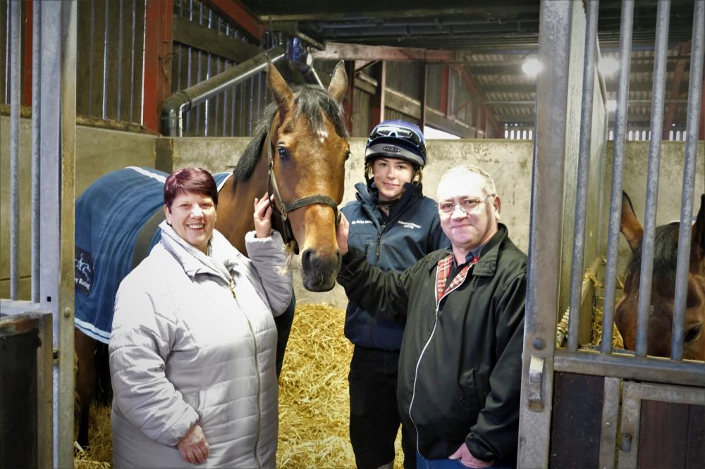 Elaine and Martyn with their favourite horse in training .. Bobhopeornohope..