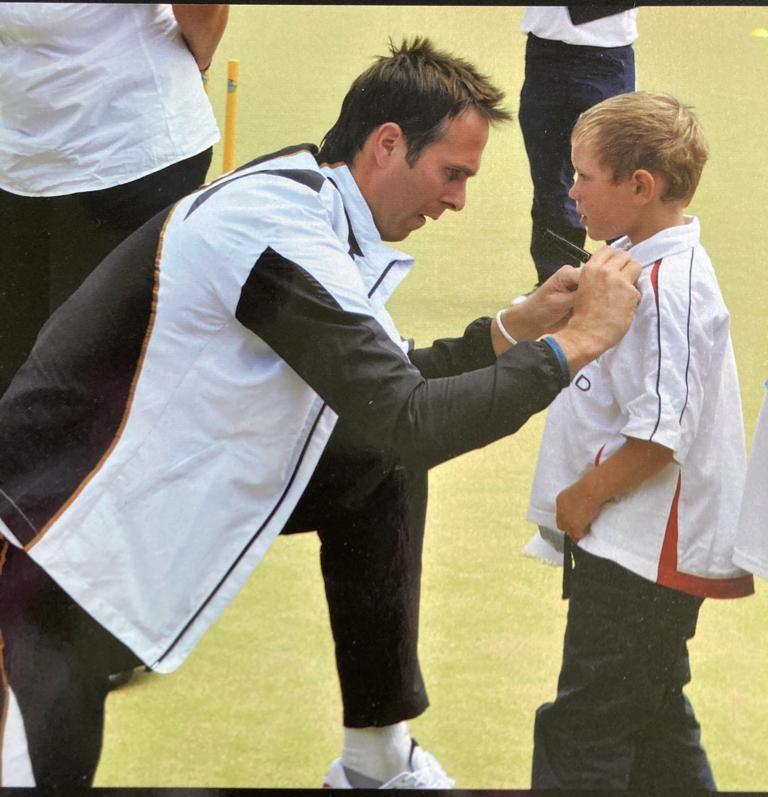 Michael Vaughan pinning a criketing medal to Archie's shirt about 11 years ago!!