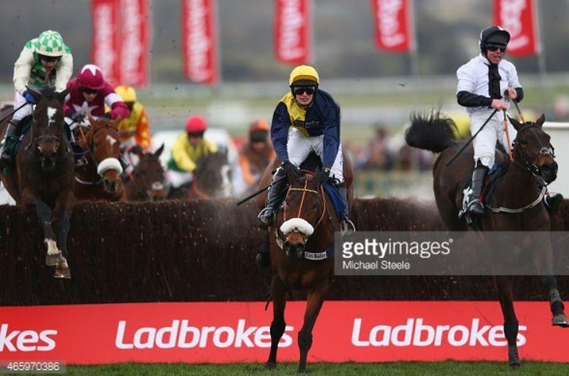 Darna and David Bass jumping the last before going on to win at last years Cheltengham Festival