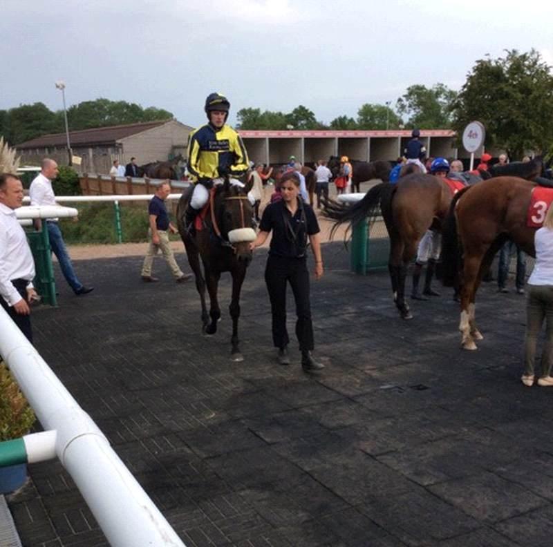 David Bass smiling away while riding Sonneofpresenting into the winners enclosure.